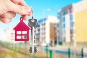 37426751-Handing-keys-in-the-house-background-Stock-Photo-house-home-estate